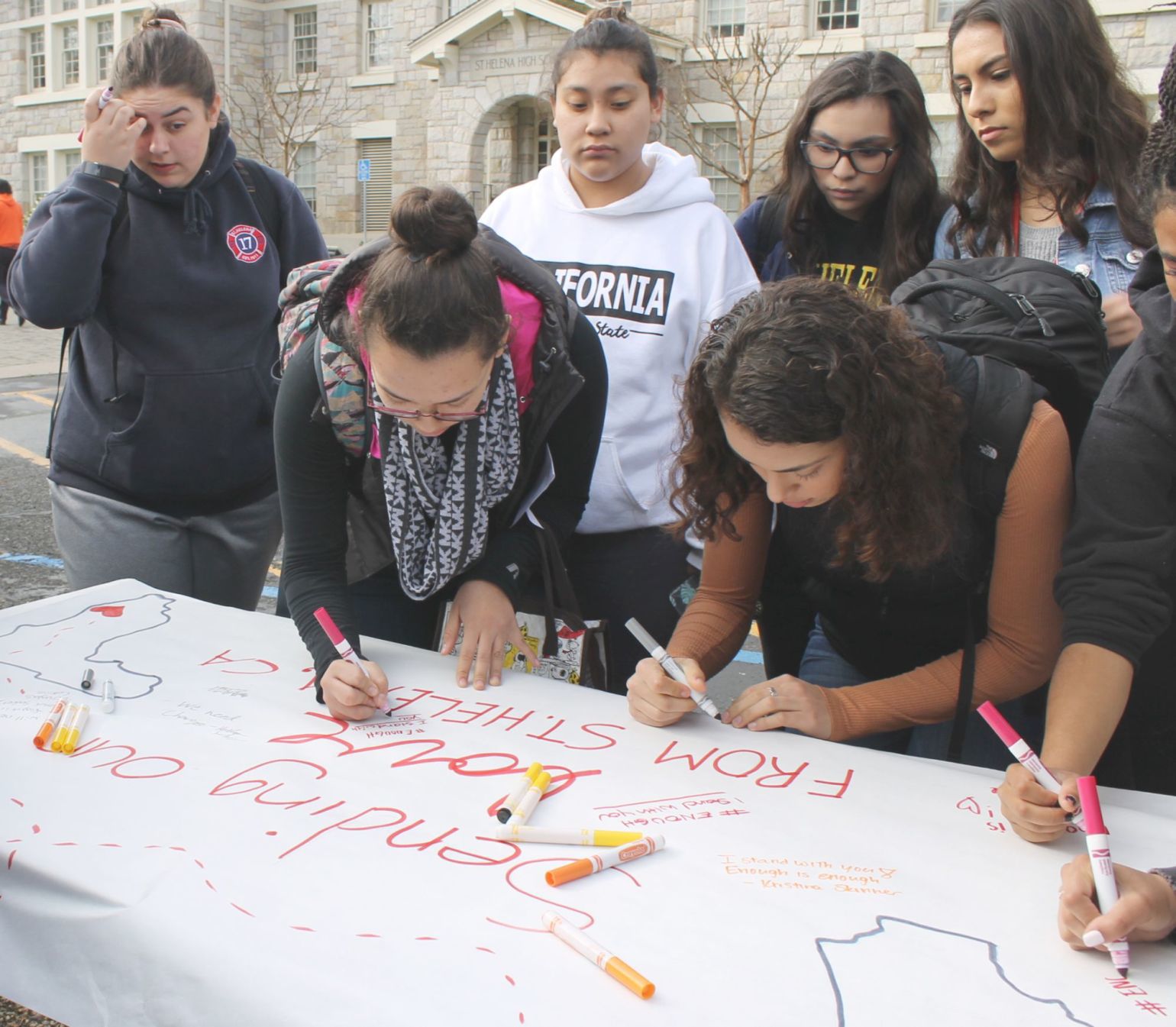 Students sign poster
